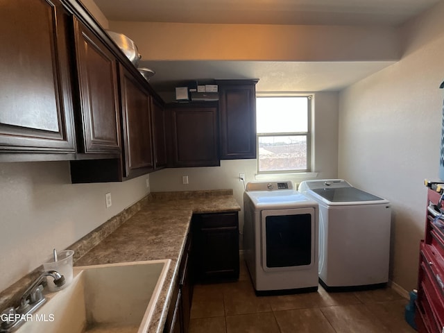 12000 Stansbury Dr, El Paso, TX 79928 - washroom with cabinet space, washer and clothes dryer, and tile patterned flooring