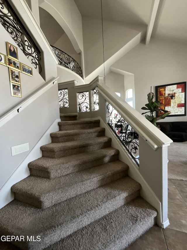 12000 Stansbury Dr, El Paso, TX 79928 - staircase with tile patterned flooring and beamed ceiling