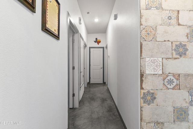 14821 Sunny Land Ave, El Paso, TX 79938 - corridor featuring concrete floors and recessed lighting