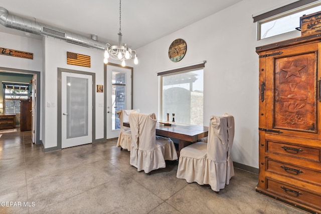14821 Sunny Land Ave, El Paso, TX 79938 - dining area with finished concrete floors and a chandelier