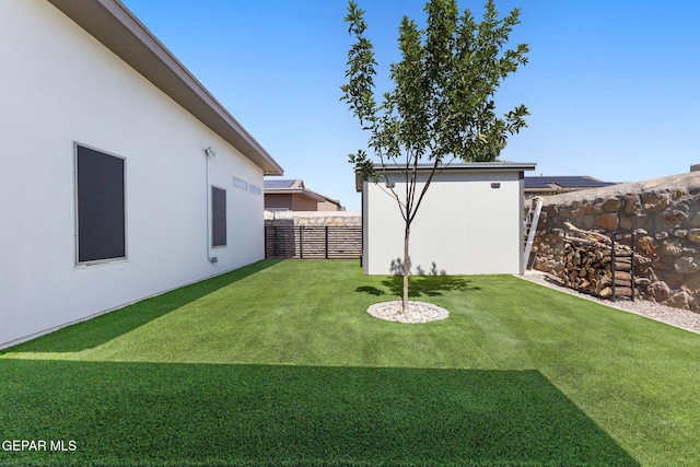 14821 Sunny Land Ave, El Paso, TX 79938 - fenced backyard featuring an outbuilding