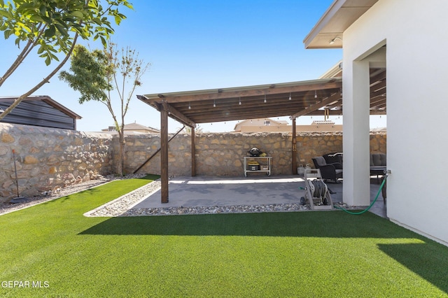 14821 Sunny Land Ave, El Paso, TX 79938 - fenced backyard with a patio