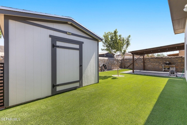 14821 Sunny Land Ave, El Paso, TX 79938 - fenced backyard with a shed and a patio area