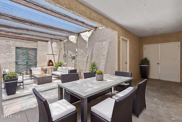 5536 Fernwood Cir, El Paso, TX 79932 - view of patio featuring an outdoor living space with a fireplace and outdoor dining space