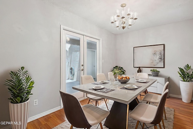 5536 Fernwood Cir, El Paso, TX 79932 - dining room featuring light wood finished floors and a chandelier