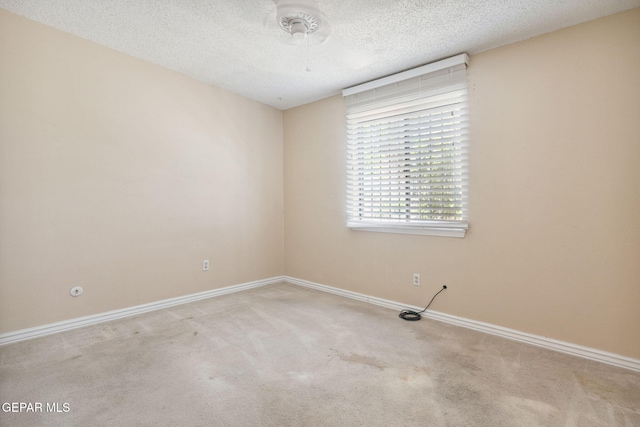 5536 Fernwood Cir, El Paso, TX 79932 - carpeted empty room with a textured ceiling and baseboards
