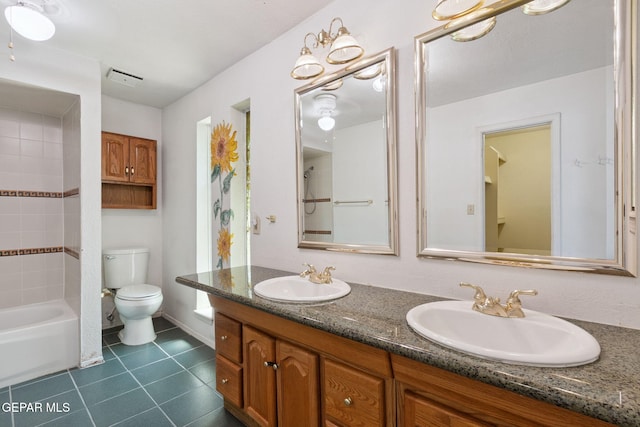 5536 Fernwood Cir, El Paso, TX 79932 - bathroom featuring tile patterned flooring, double vanity, and washtub / shower combination