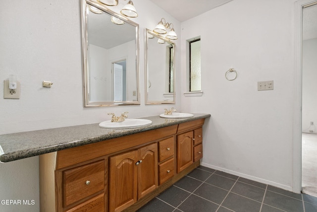 5536 Fernwood Cir, El Paso, TX 79932 - bathroom featuring double vanity and tile patterned flooring