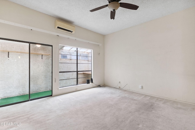 5536 Fernwood Cir, El Paso, TX 79932 - unfurnished bedroom with a wall mounted AC, carpet flooring, a textured ceiling, a ceiling fan, and a closet