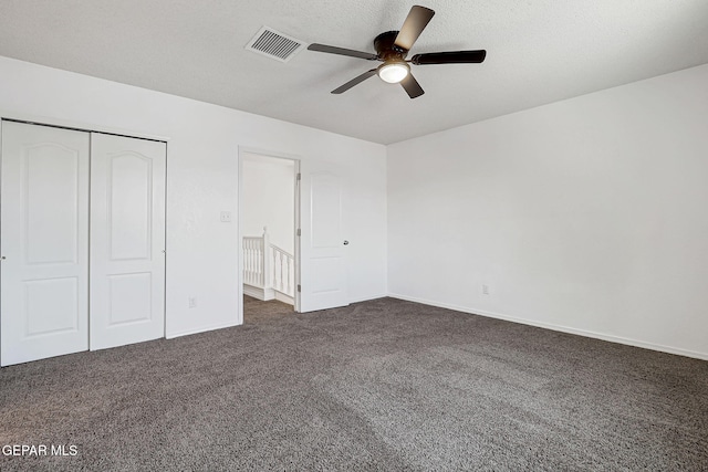11948 Crown Oaks Ct, El Paso, TX 79936 - unfurnished bedroom featuring dark colored carpet, a closet, and ceiling fan
