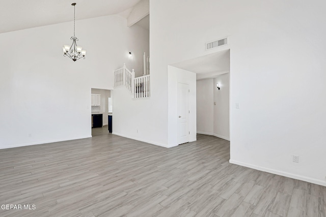 11948 Crown Oaks Ct, El Paso, TX 79936 - unfurnished living room featuring high vaulted ceiling, a chandelier, light wood-style floors, and beam ceiling