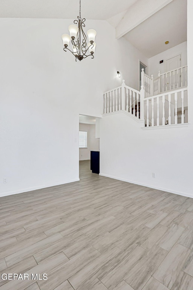 11948 Crown Oaks Ct, El Paso, TX 79936 - unfurnished living room with a chandelier, high vaulted ceiling, wood finished floors, and beamed ceiling