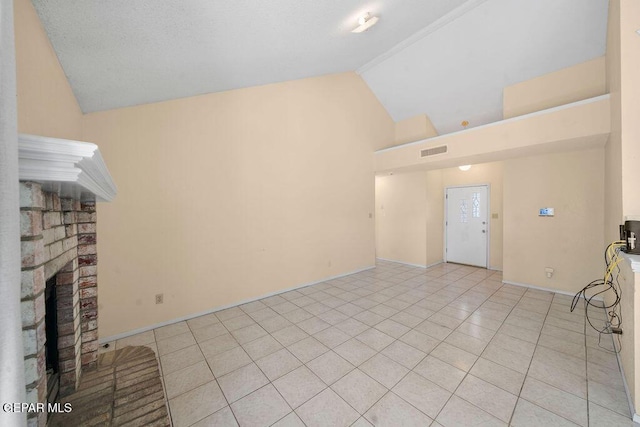 11984 Manuel Acosta Dr, El Paso, TX 79936 - unfurnished living room featuring high vaulted ceiling, a fireplace, and light tile patterned flooring