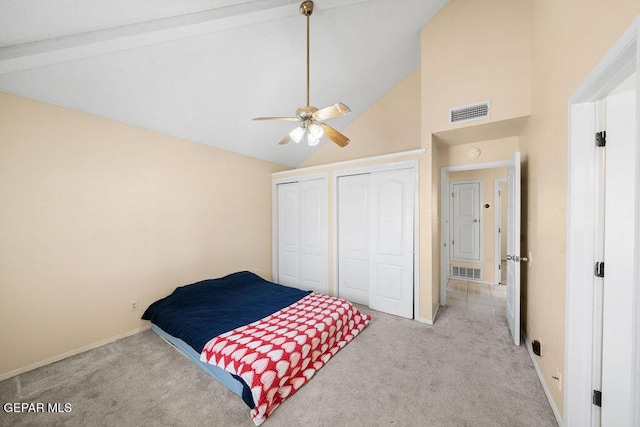 11984 Manuel Acosta Dr, El Paso, TX 79936 - carpeted bedroom with two closets, high vaulted ceiling, ceiling fan, and beam ceiling