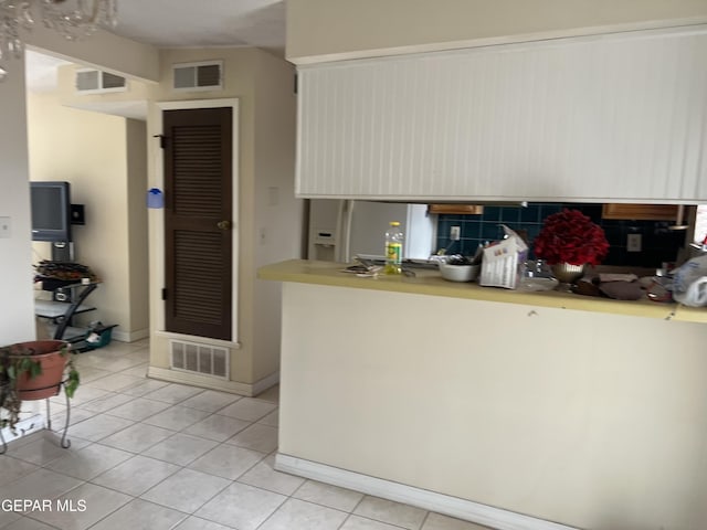 327 Jesuit Dr, El Paso, TX 79907 - kitchen with light tile patterned flooring, white refrigerator with ice dispenser, and light countertops