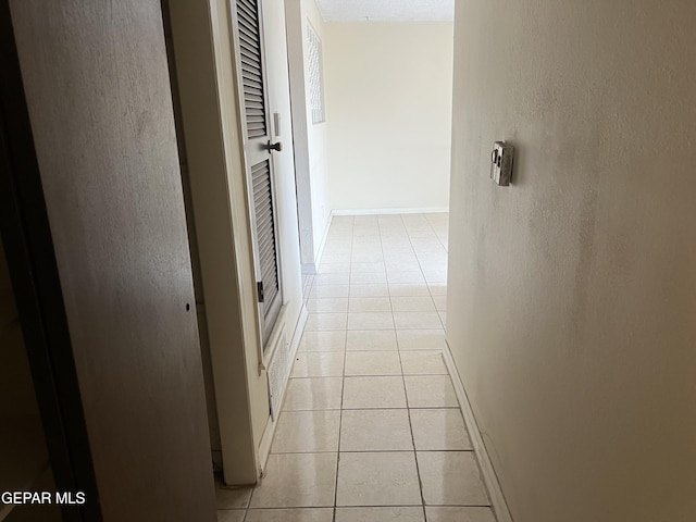 327 Jesuit Dr, El Paso, TX 79907 - hall with light tile patterned floors and baseboards