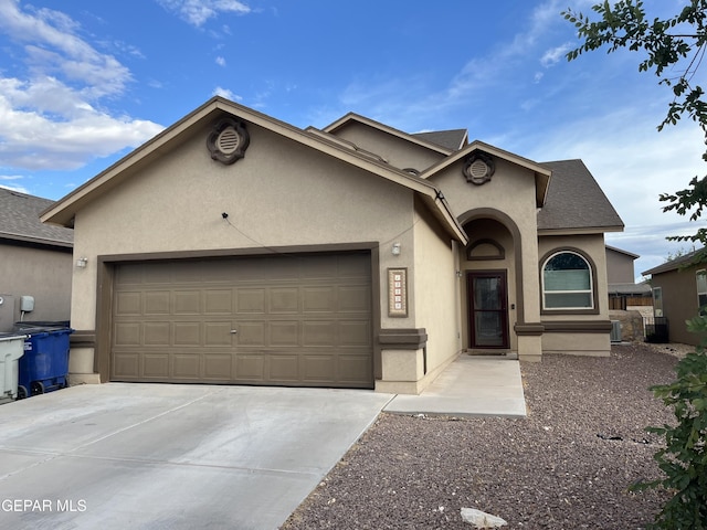 14428 Johnny Mata Dr, El Paso, TX 79938 - view of front of house featuring an attached garage, stucco siding, and concrete driveway