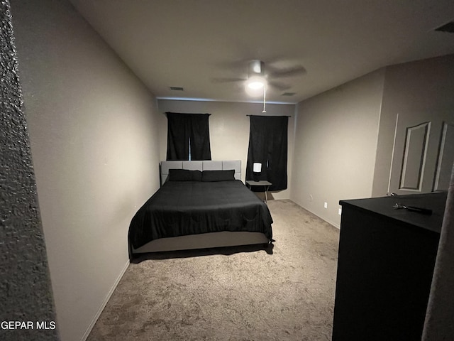 14428 Johnny Mata Dr, El Paso, TX 79938 - carpeted bedroom with baseboards and ceiling fan