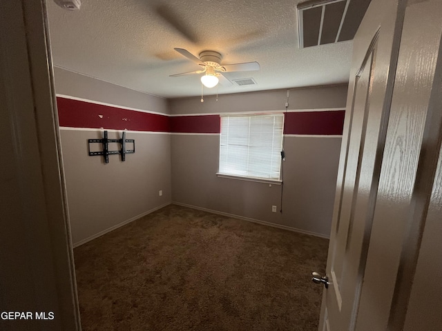 14428 Johnny Mata Dr, El Paso, TX 79938 - empty room featuring a textured ceiling, carpet, and a ceiling fan