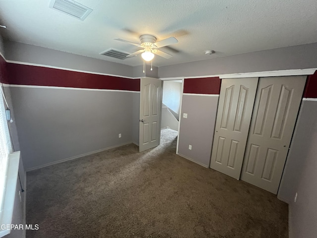 14428 Johnny Mata Dr, El Paso, TX 79938 - unfurnished bedroom with carpet, a closet, and a ceiling fan