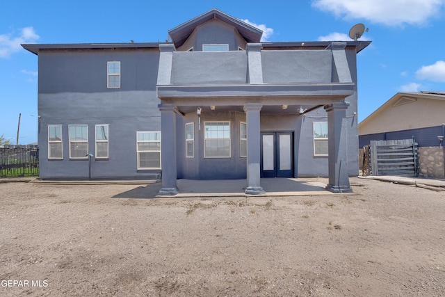 3165 Destiny Point Dr, El Paso, TX 79938 - rear view of house featuring stucco siding, french doors, and a patio