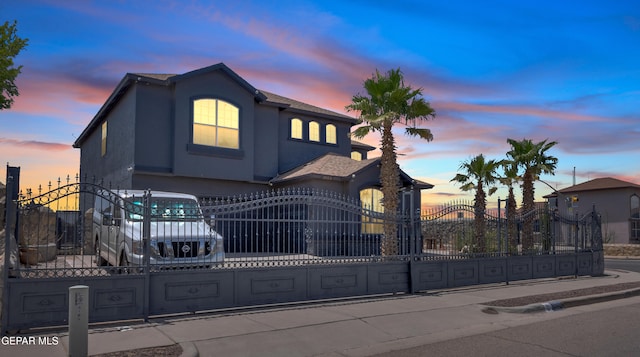 3165 Destiny Point Dr, El Paso, TX 79938 - view of front of property with a gate, a fenced front yard, stucco siding, and an attached garage