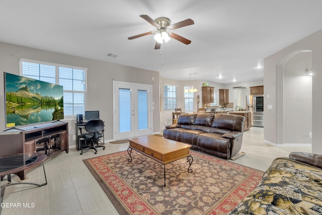 3165 Destiny Point Dr, El Paso, TX 79938 - living room featuring ceiling fan, arched walkways, french doors, and an office area