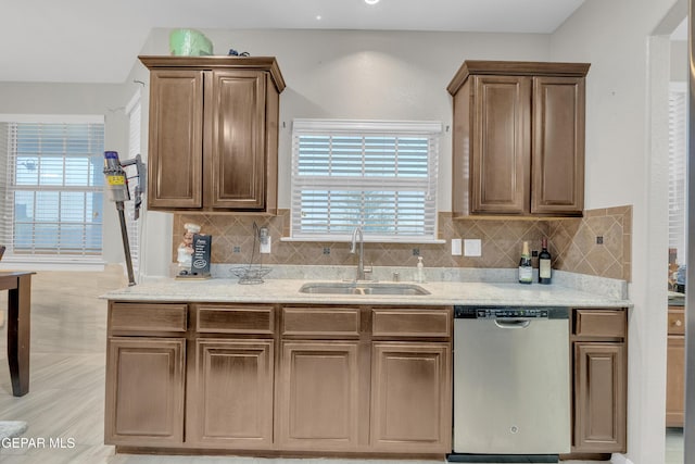 3165 Destiny Point Dr, El Paso, TX 79938 - kitchen with dishwasher, tasteful backsplash, and light stone countertops