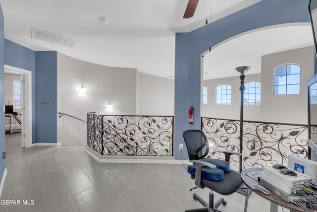 3165 Destiny Point Dr, El Paso, TX 79938 - home office with a ceiling fan and arched walkways