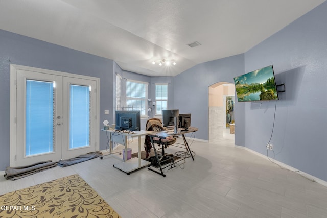 3165 Destiny Point Dr, El Paso, TX 79938 - office area featuring arched walkways, french doors, vaulted ceiling, and tile patterned floors