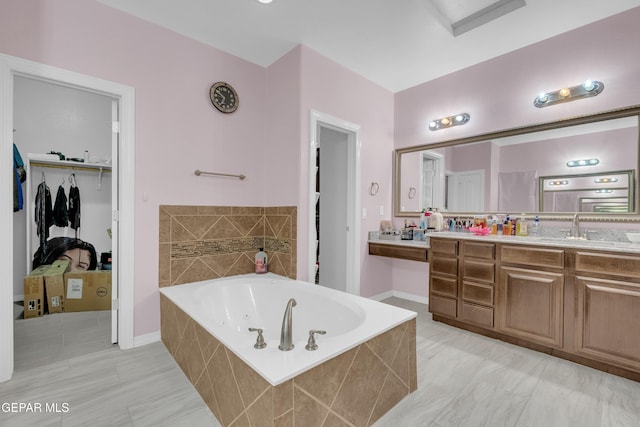 3165 Destiny Point Dr, El Paso, TX 79938 - full bath with double vanity, a jetted tub, and a walk in closet