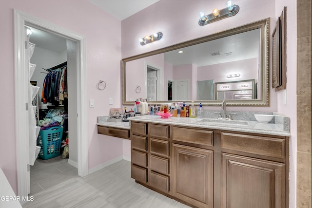 3165 Destiny Point Dr, El Paso, TX 79938 - bathroom featuring vanity and a spacious closet