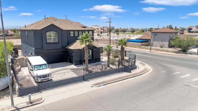 3165 Destiny Point Dr, El Paso, TX 79938 - view of front of property with a fenced front yard, a gate, an attached garage, and stucco siding