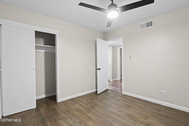 15081 Darrington Rd, Horizon City, TX 79928 - unfurnished bedroom with wood finished floors, a closet, and ceiling fan