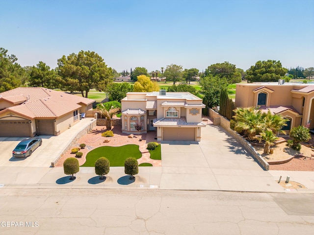 18986 Armington Dr, Horizon City, TX 79928 - mediterranean / spanish-style house featuring driveway, stucco siding, and an attached garage