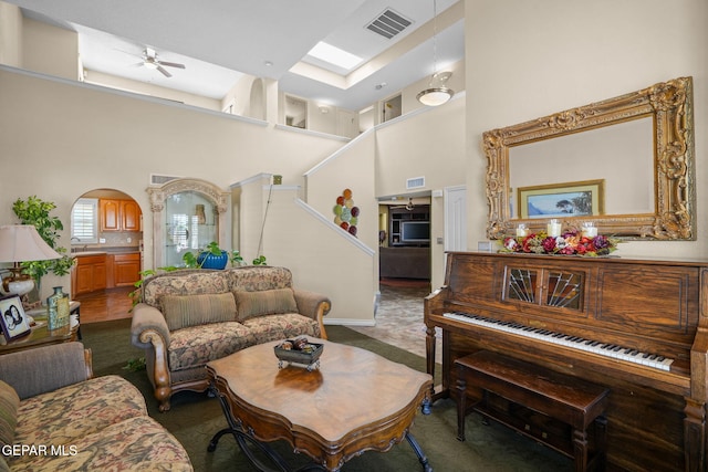 18986 Armington Dr, Horizon City, TX 79928 - carpeted living area with a towering ceiling and a ceiling fan