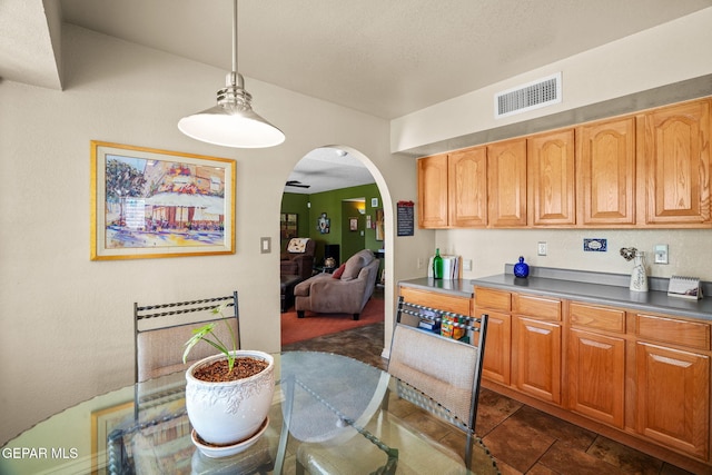 18986 Armington Dr, Horizon City, TX 79928 - kitchen with arched walkways and pendant lighting