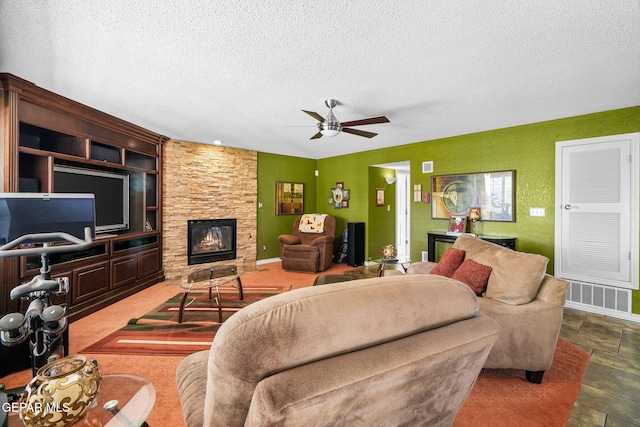 18986 Armington Dr, Horizon City, TX 79928 - living area with a fireplace, a textured ceiling, ceiling fan, and built in features