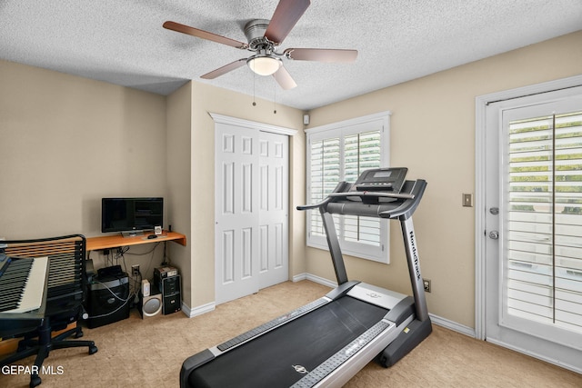 18986 Armington Dr, Horizon City, TX 79928 - exercise area featuring carpet floors, plenty of natural light, a ceiling fan, and a textured ceiling
