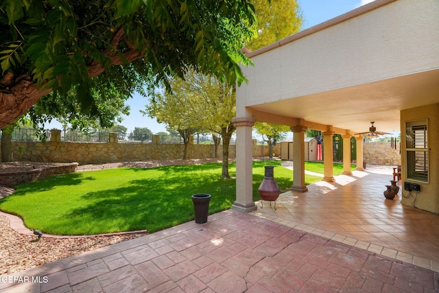 18986 Armington Dr, Horizon City, TX 79928 - fenced backyard with a patio area and ceiling fan