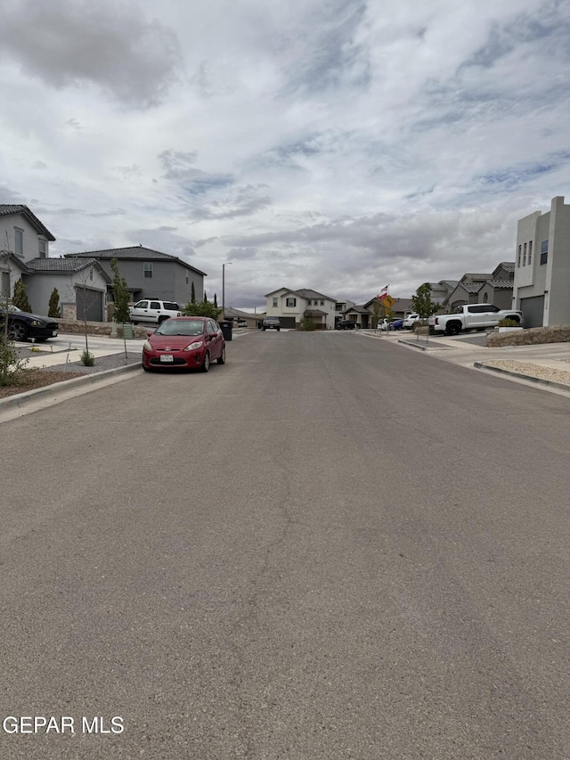 229 Epsom Dr, El Paso, TX 79928 - view of asphalt street with a residential view, curbs, and sidewalks