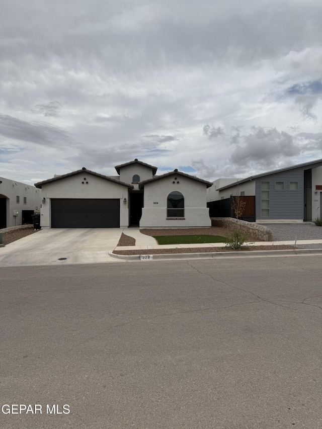 229 Epsom Dr, El Paso, TX 79928 - view of front facade with stucco siding, a garage, and concrete driveway