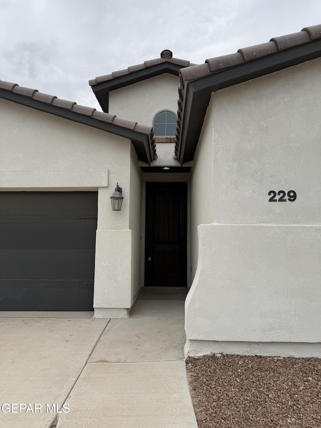 229 Epsom Dr, El Paso, TX 79928 - entrance to property with stucco siding and an attached garage