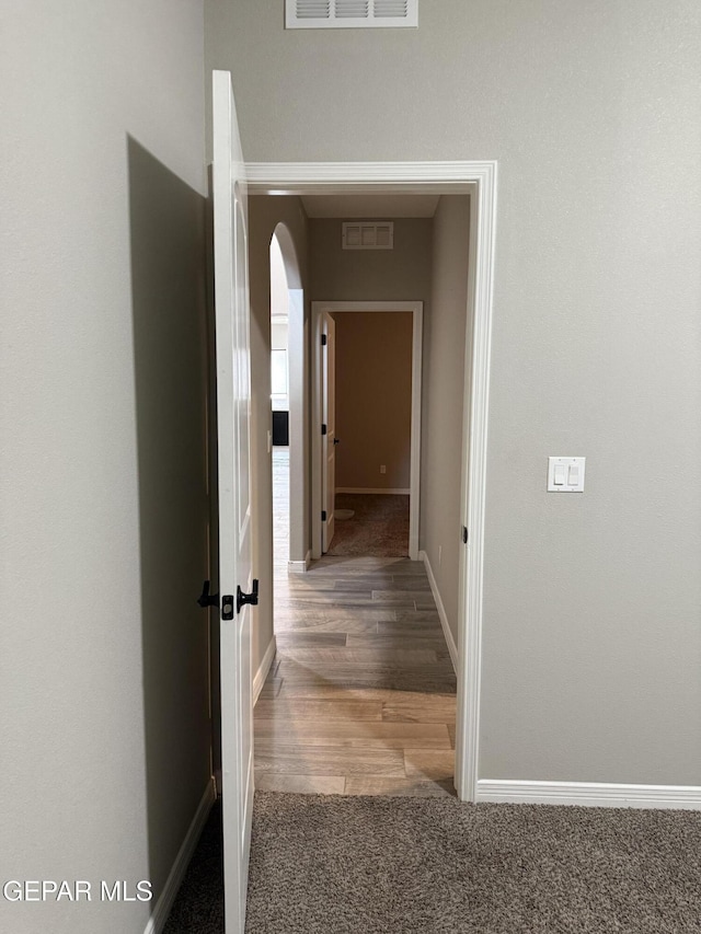 229 Epsom Dr, El Paso, TX 79928 - hall with arched walkways, wood finished floors, and carpet