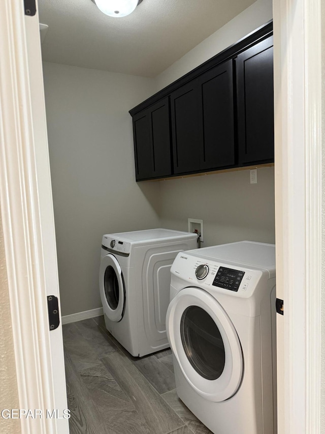 229 Epsom Dr, El Paso, TX 79928 - laundry room featuring washer and clothes dryer and cabinet space