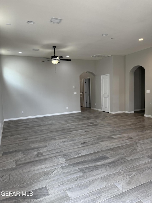229 Epsom Dr, El Paso, TX 79928 - spare room featuring arched walkways, ceiling fan, wood finished floors, and recessed lighting