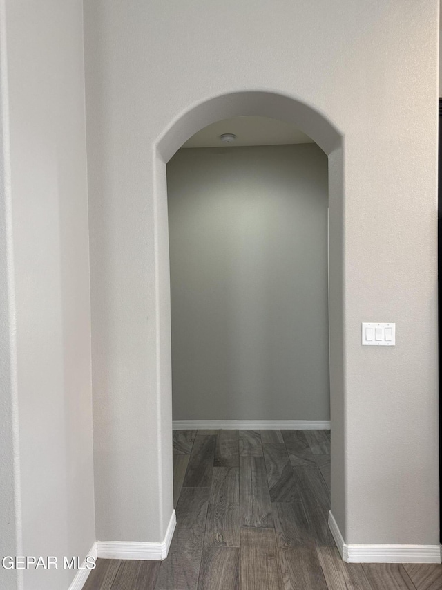 229 Epsom Dr, El Paso, TX 79928 - hallway with dark wood-style floors and arched walkways