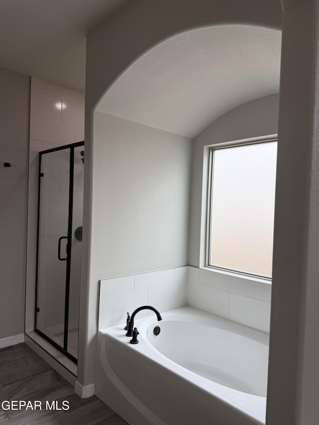 229 Epsom Dr, El Paso, TX 79928 - bathroom with a garden tub, a stall shower, and wood finished floors