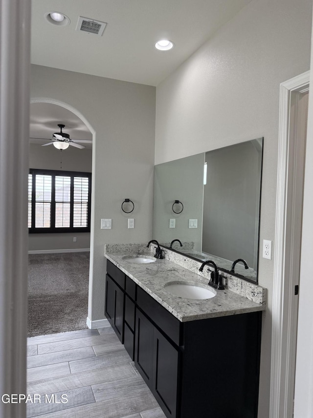 229 Epsom Dr, El Paso, TX 79928 - bathroom with ceiling fan, double vanity, wood finished floors, and recessed lighting