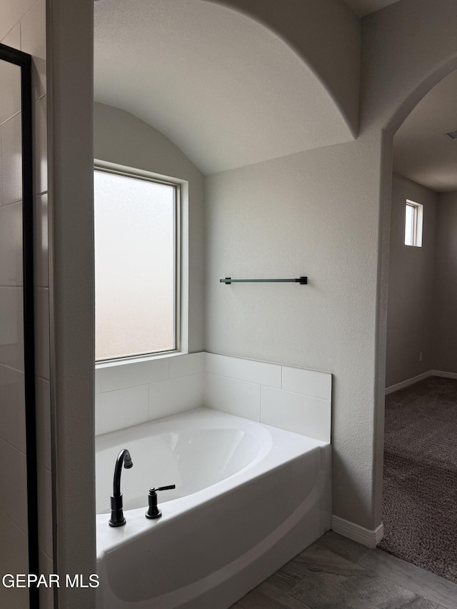 229 Epsom Dr, El Paso, TX 79928 - bathroom with a garden tub and vaulted ceiling